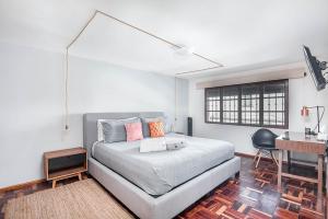 A bed or beds in a room at Finca Coyoacán