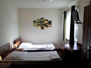 Posteľ alebo postele v izbe v ubytovaní Motel Orion Wolsztyn + 28 fotografií
