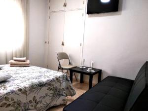 Postel nebo postele na pokoji v ubytování GOLDEN TOWER pensión Auto Check-in