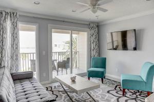 a living room with a couch and two chairs at La Bella Vita - Luxury Waterfront Condo-Free WIFI-Heated Pool in Tampa