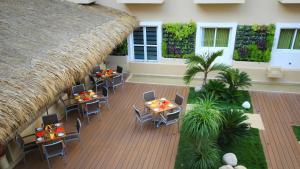 an overhead view of a patio with tables and chairs at Holiday Inn Huatulco, an IHG Hotel in Santa Cruz Huatulco