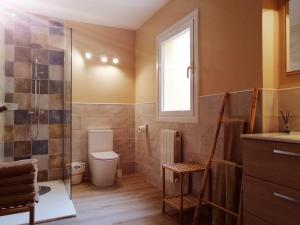 a bathroom with a shower and a toilet and a sink at La casa del Duero in Tordesillas