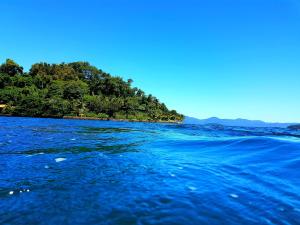 an island in the middle of a body of water at Acrópolis Marina Hotel in Angra dos Reis