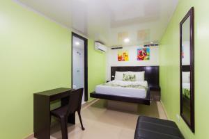 Postel nebo postele na pokoji v ubytování Hotel Marina Suites By GEH Suites