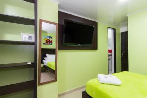 Postel nebo postele na pokoji v ubytování Hotel Marina Suites By GEH Suites