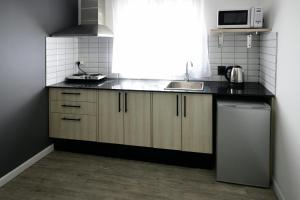 Virtuvė arba virtuvėlė apgyvendinimo įstaigoje Quijano Hotel - Aparts & Suites