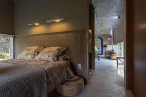 Ένα ή περισσότερα κρεβάτια σε δωμάτιο στο Villa Astrolabio Refugio