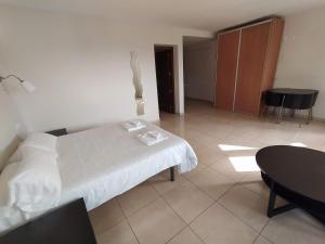Postel nebo postele na pokoji v ubytování Hostal Gran Sol