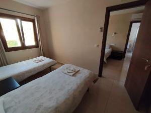 Postel nebo postele na pokoji v ubytování Hostal Gran Sol