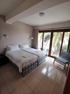 Postel nebo postele na pokoji v ubytování Hostal Gran Sol