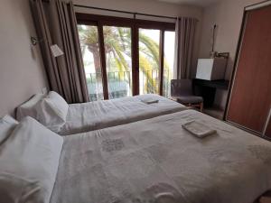 Postel nebo postele na pokoji v ubytování Hostal Gran Sol