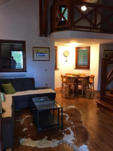 a living room with a couch and a table at Greencajt in Jakopovec