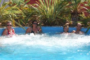 a group of people in a swimming pool at Lagrange Grand Bleu Vacances – Résidence Les Pescalunes in Agde