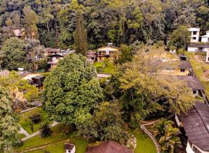 an aerial view of a village with trees and houses at Hotel da Cachoeira in Penedo