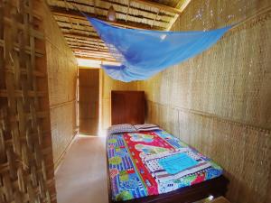 Säng eller sängar i ett rum på Mecong Homestay