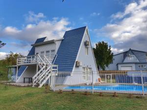 a house with a swimming pool in front of it at Beach you to it - Sedgefield in Sedgefield