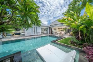 a swimming pool in the middle of a villa at Villa Bima - 3 Bedroom Villa in Seminyak in Seminyak