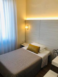 Postel nebo postele na pokoji v ubytování Hotel La Nuova Rotaia