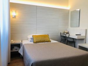 Postel nebo postele na pokoji v ubytování Hotel La Nuova Rotaia
