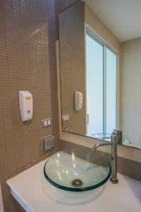 Salle de bains dans l'établissement Tai-Pan Resort and Condominium