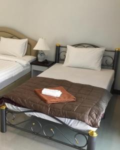 Postel nebo postele na pokoji v ubytování Tan Residence