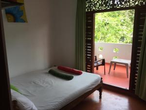 Postel nebo postele na pokoji v ubytování Diwanka Villa