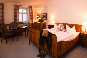 Postel nebo postele na pokoji v ubytování Posthotel Kolberbräu