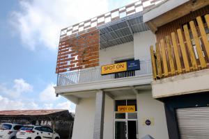 a building with a sign that says spot on at SPOT ON 2723 Gatsu Kost in Nganjuk