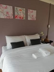 a large white bed with two pillows on it at Puleng's Granny Flat in Richards Bay