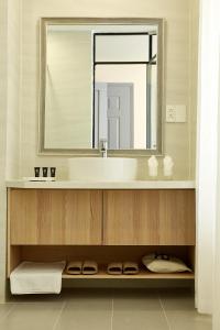 a bathroom with a sink and a mirror at 8B Aparthotel in Ho Chi Minh City