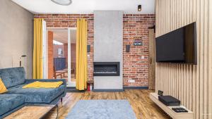 Televízia a/alebo spoločenská miestnosť v ubytovaní 4 Elements - BillBerry Apartments