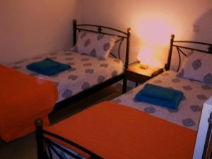 A bed or beds in a room at Dimitrios Apartments