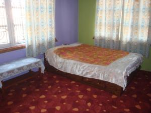 Ein Bett oder Betten in einem Zimmer der Unterkunft Bimu Home