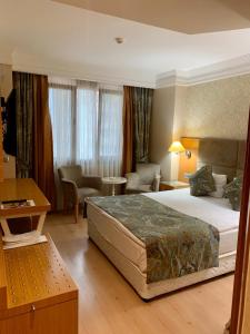 Postel nebo postele na pokoji v ubytování Adana Yukselhan Hotel