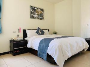 Una cama o camas en una habitación de Be Yun Tien Resort