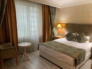 Vuode tai vuoteita majoituspaikassa Adana Yukselhan Hotel