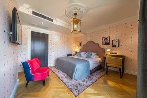 Postel nebo postele na pokoji v ubytování Hotel Capital