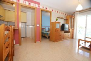 a large room with a kitchen and a living room at COSTA DAURADA APARTAMENTS - Larimar in Salou
