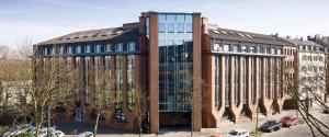 a large brick building with a lot of windows at Haus am Zoo Apartments verschiedene Adressen in Düsseldorf