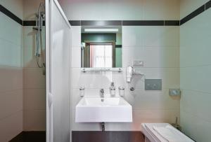 a bathroom with a white sink and a mirror at Hotel Prague Star in Prague +113 photos