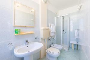 a bathroom with a sink and a toilet and a shower at Albergo Nuova Aurora - FREE PARKING & BREAKFAST in Marghera +49 photos