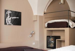 a bedroom with a bunk bed and aiger at Hotel Italia in Noli