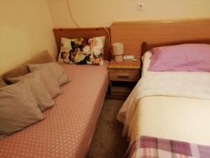 Postel nebo postele na pokoji v ubytování Apartman Lara
