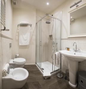 a bathroom with a shower and a toilet and a sink at Tornabuoni View in Florence