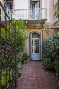 a front door of a house with a balcony at Scricciolo in Viareggio