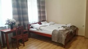 Posteľ alebo postele v izbe v ubytovaní Parkowa Rezydencja Hubal