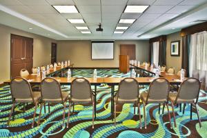a conference room with a long table and chairs at Holiday Inn Express Hastings by IHG in Hastings +23 photos