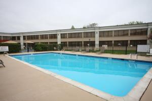 a large swimming pool in front of a building at Holiday Inn Hazlet by IHG in Hazlet