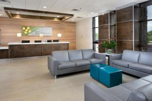 an office lobby with couches and a waiting room at Holiday Inn Johnson City by IHG in Johnson City