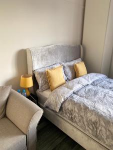 a bed and a couch in a room at Small Self Contained Studio In Sutton Coldfield in Birmingham